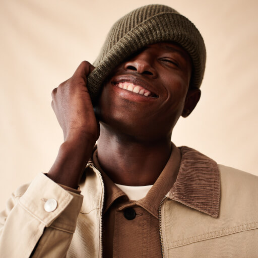 Man wearing beige shacket.