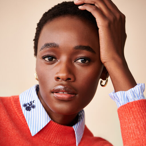 Woman wearing red jumper.