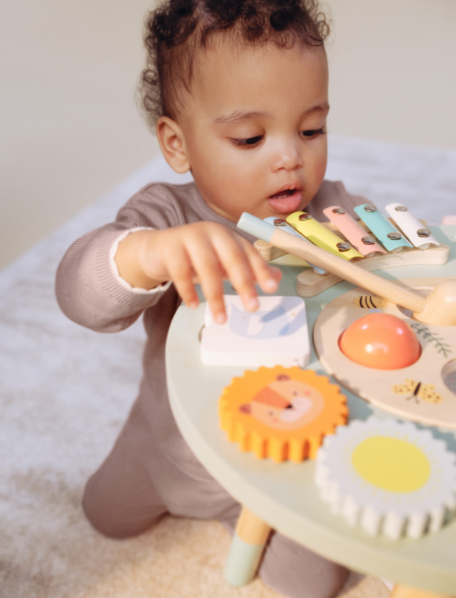 Baby playing with toys.