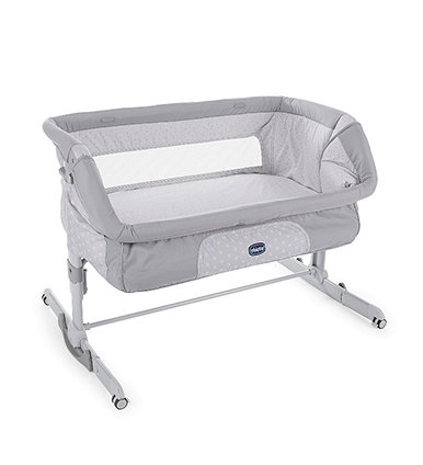 Grey and white bedside crib.